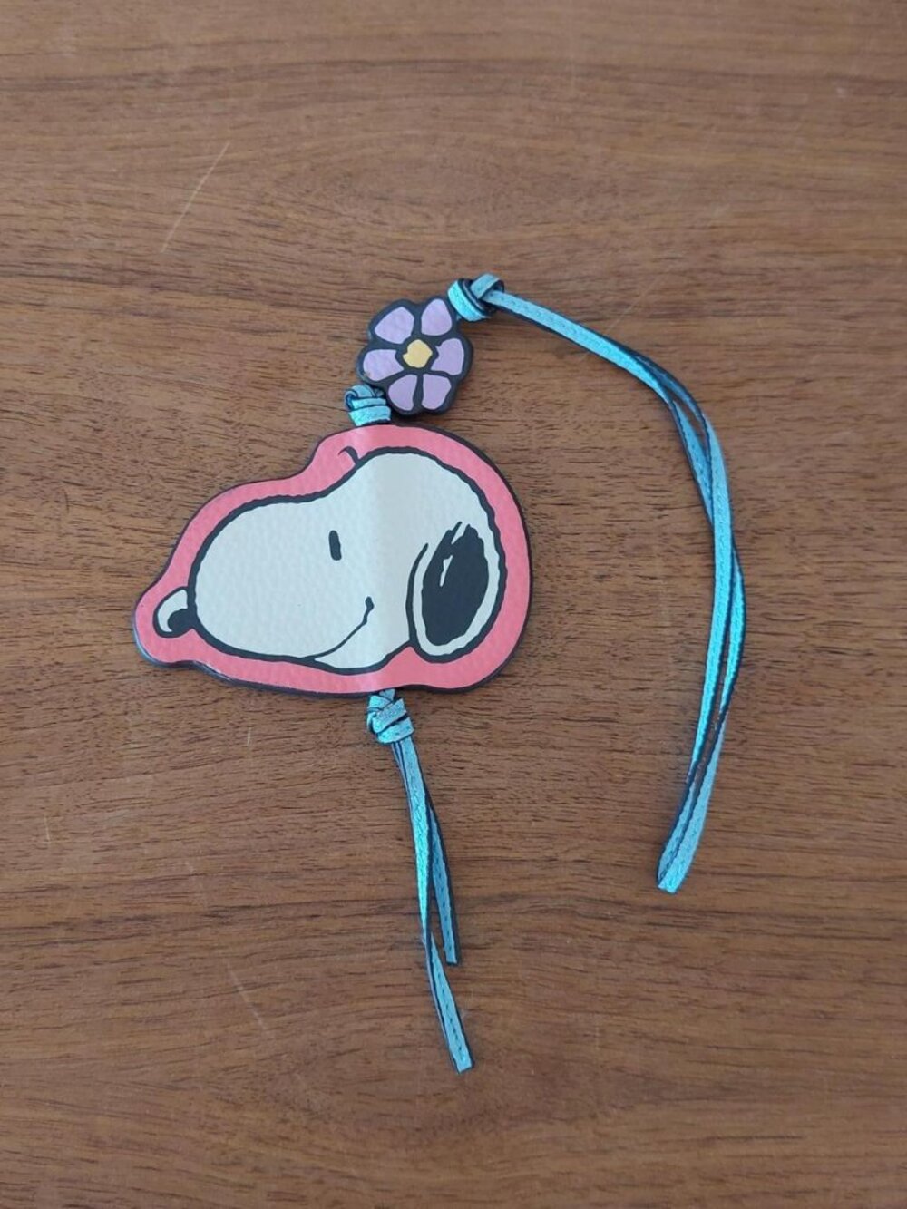 Vera Bradley x Peanuts Snoopy headband with pink Snoopy graphic and purple flowe